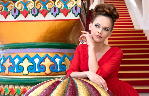 Beautiful russian girl in red dress — Stock Photo, Image