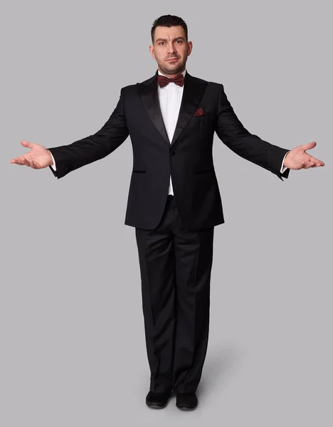 Fashion man in tuxedo standing — Stock Photo, Image