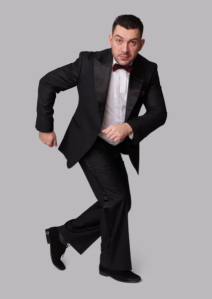 Funny elegant man in black tuxedo — Stock Photo, Image