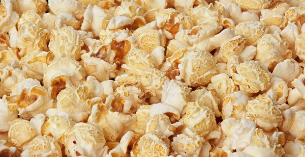Bakgrund av popcorn flingor. Livsmedelsstruktur — Stockfoto
