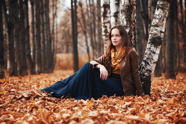 Pretty woman in the autumn park. Outdoors portrait