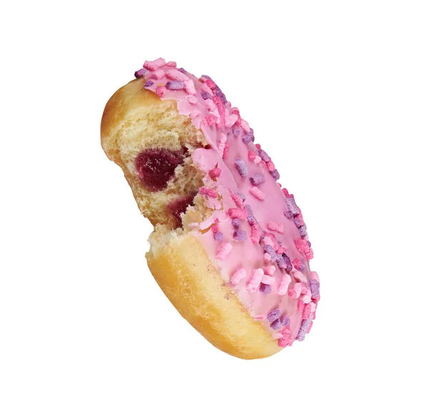 Pink glazed bitten round donut with sprinkles isolated — 스톡 사진