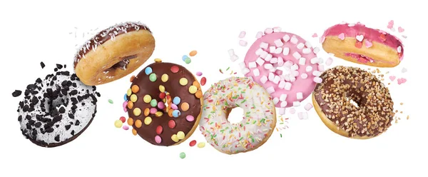 Flying glazed round doughnuts. Mix of multicolored sweet donuts — Stock Photo, Image