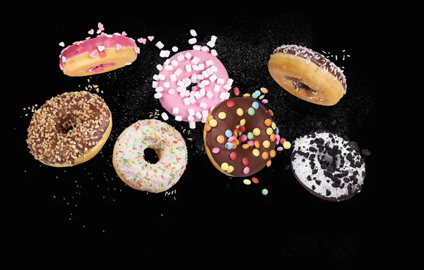 Donuts Coloridos Fundo Preto — Fotografia de Stock