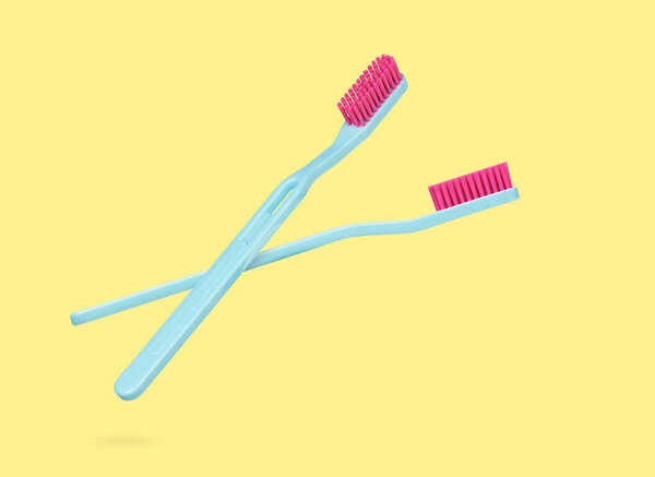 toothbrush for dental care. Isolated on yellow