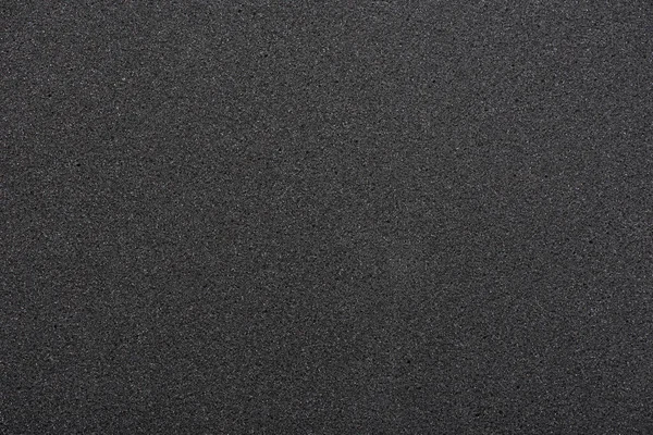 黒のスポンジのような質感 発泡ゴムの背景 — ストック写真