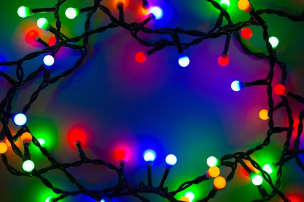 Gekleurde christmas lights achtergrond — Stockfoto