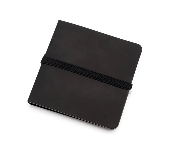 Černé uzavřené notebook izolované bílém pozadí — Stock fotografie