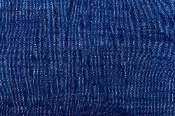 En jeans indigo bakgrund eller konsistens — Stockfoto