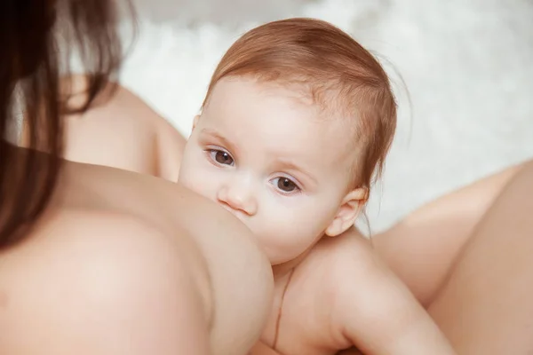 Beautiful mom breast feeding her newborn child. — Stock Photo, Image