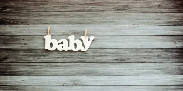 Dřevěné pozadí s nápisem baby — Stock fotografie