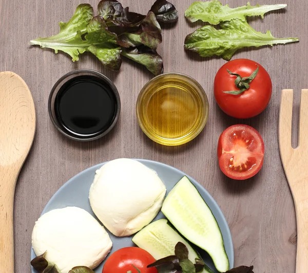 Salad mozzarella cheese tomatoes balsamic vinegar olive oil on a — Stock Photo, Image