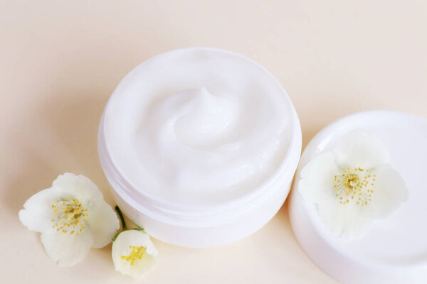 Cream moisturizer in the white jar. The concept of health and beauty.