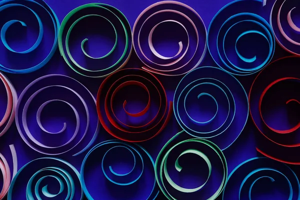 Mavi Arkaplandaki Kağıttan Yapılmış Çok Renkli Spiraller — Stok fotoğraf