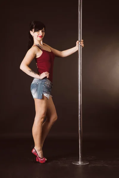 Dancing on a pole — Stock Photo, Image