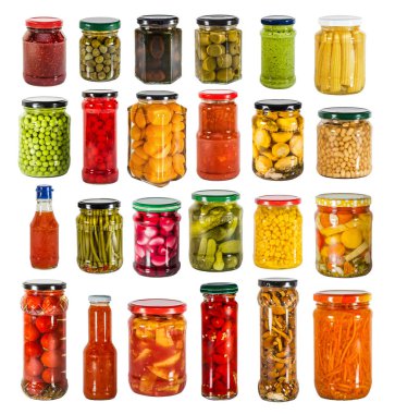 Big collection of tinned preserved vegetables and fruit in glass jars. Isolated on white.