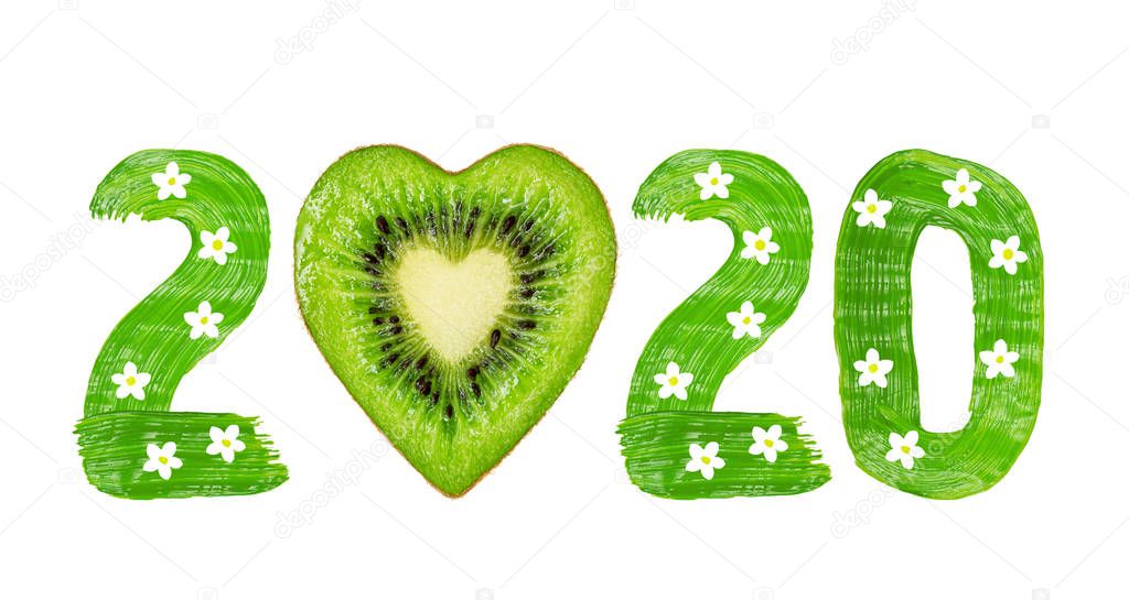 For Christmas and New Year. The inscription 2020 and the heart drawn by green paints with white blossom and kiwi.  Isolated on white.