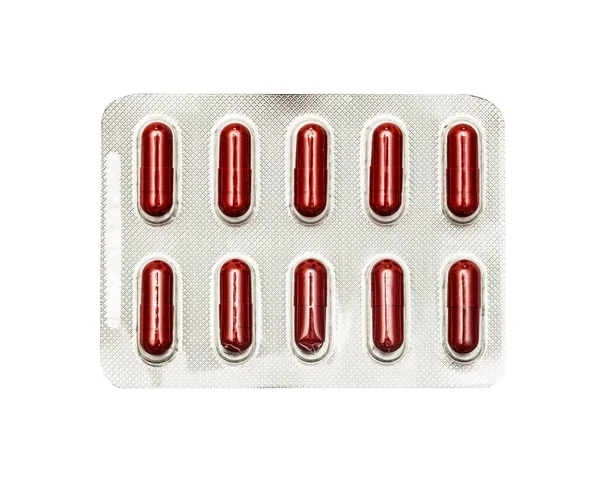 Piros Pirulákat Tablettákat Tésztákat Csomagolok Fehér Alapon Elszigetelve — Stock Fotó
