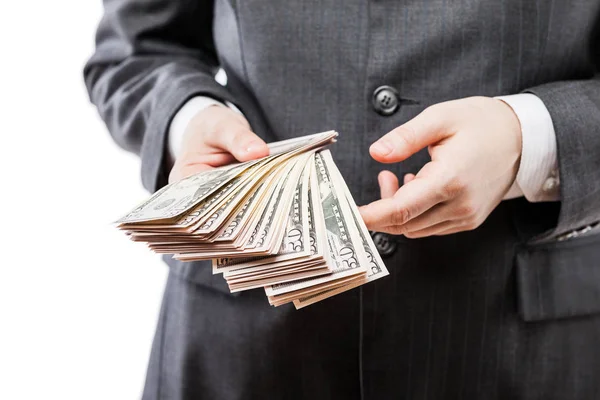 Zakenman in zwart pak hand met ons dollar munt geld — Stockfoto