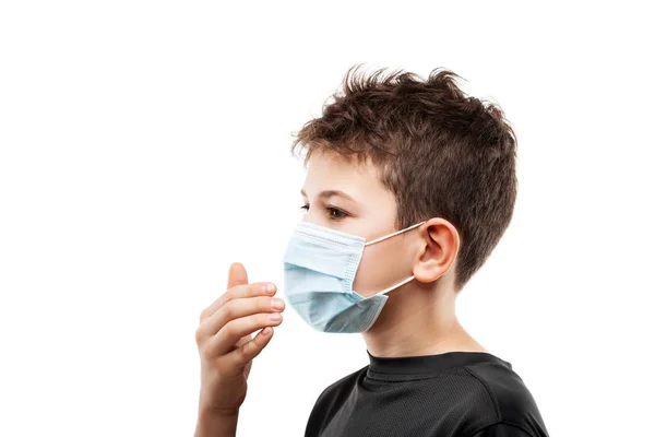 Teenager boy wearing respiratory protective medical mask — Stock Photo, Image