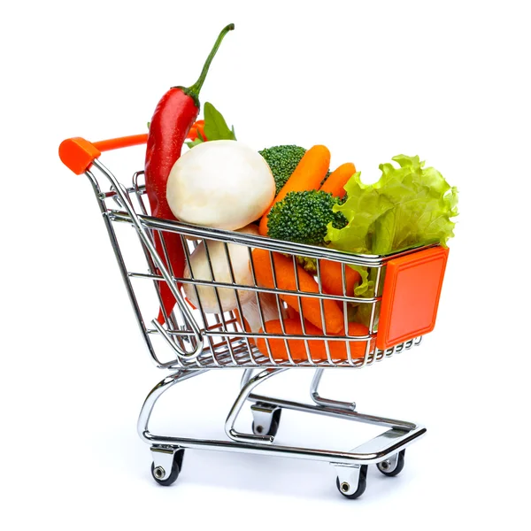 Mini carrinho de compras cheio de legumes — Fotografia de Stock