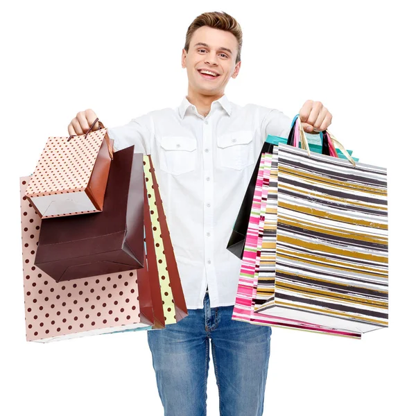 Retrato de jovem feliz sorrindo homem com sacos de compras — Fotografia de Stock