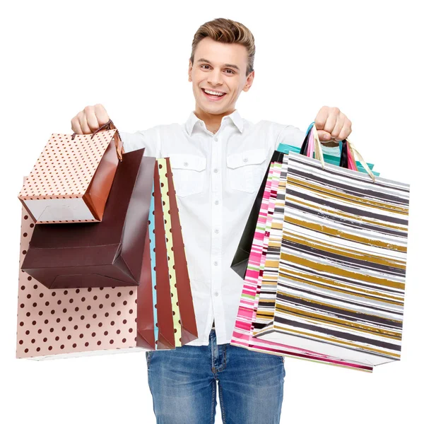 Retrato de jovem feliz sorrindo homem com sacos de compras — Fotografia de Stock