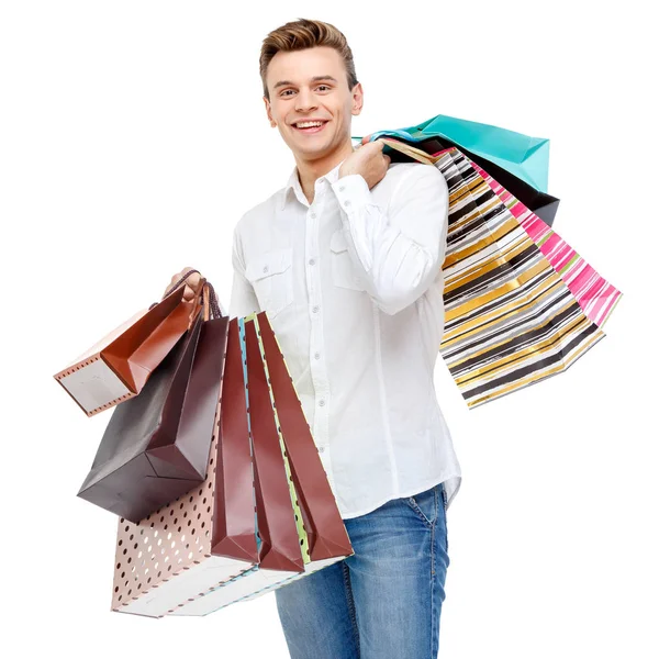 年轻快乐的男人微笑着购物袋的肖像 — 图库照片