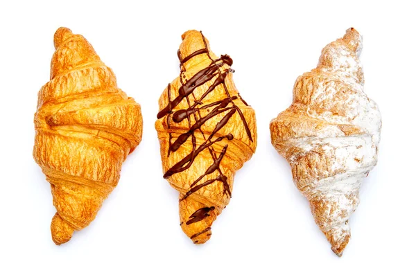 Trois croissants frais sur fond blanc — Photo