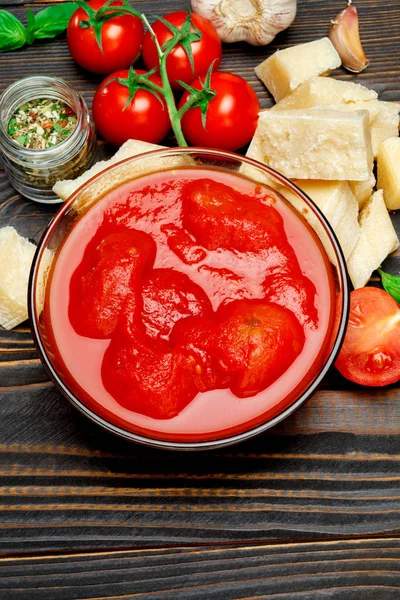Tomato sauce or puree on wooden table — Stock Photo, Image