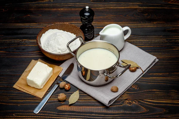 Bechamel sauce in a pan and ingredients — Stock Photo, Image