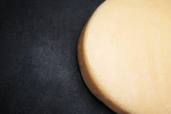 Whole round Head of parmesan or parmigiano hard cheese on concrete background — Stock Photo, Image