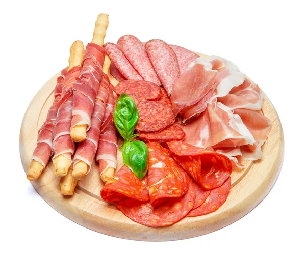 Cold smoked meat plate with pork chops, prosciutto, salami and bread sticks — Stock Photo, Image