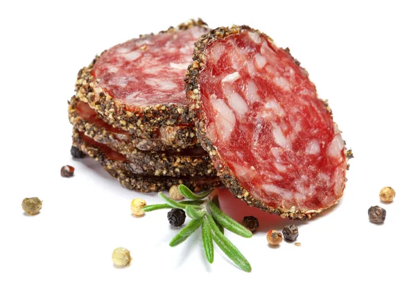 Dried sliced organic salami sausage on white background — Stock Photo, Image