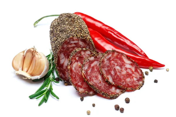 Torkade ekologiska salami korv täckt med peppar på vit bakgrund — Stockfoto