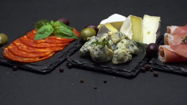 Various type of italian meal or snack - cheese, sausage, olives and parma — Stock Video