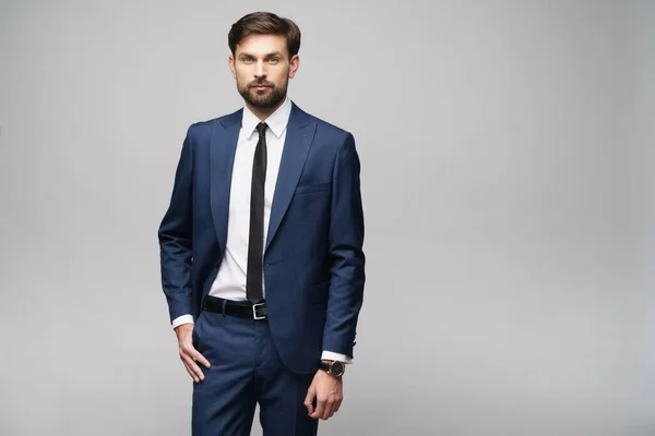 Studio photo of young handsome businessman wearing suit — Stock Photo, Image