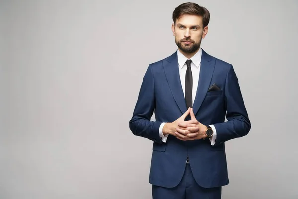 Studio photo of young handsome businessman wearing suit — Stock Photo, Image