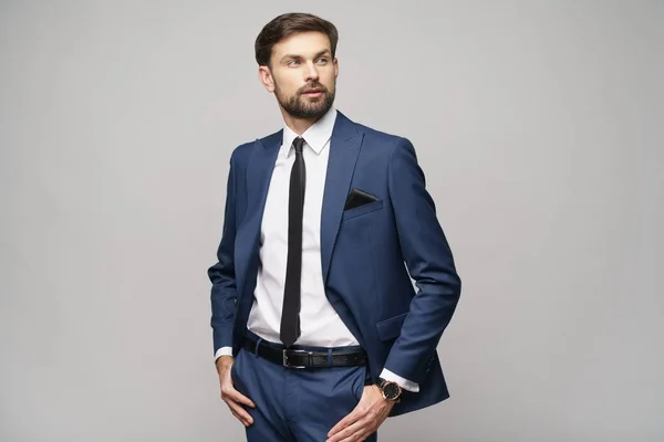 Studio photo of young handsome businessman wearing suit — Stock Photo, Image