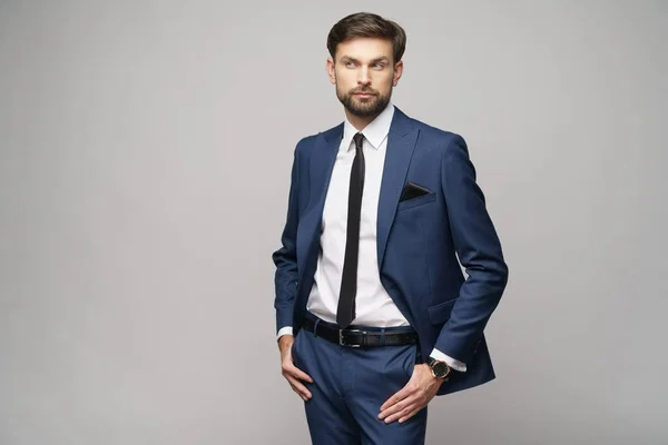 Studio photo of young handsome businessman wearing suit — Stock Photo, Image