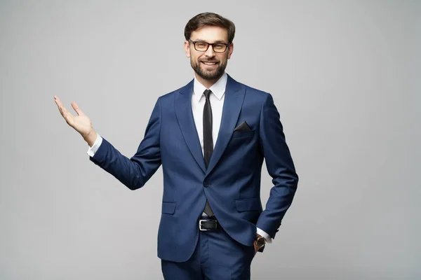 Portrait of a young businessman pointing on a copyspace with his finger — Stock Photo, Image