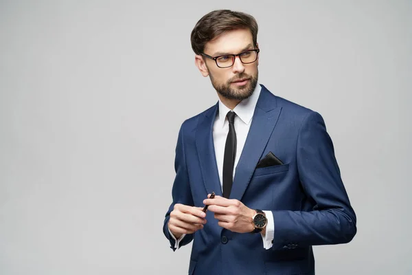 Studuo shot of thinking solving problem businessman wearing suit holding pen — Stock Photo, Image