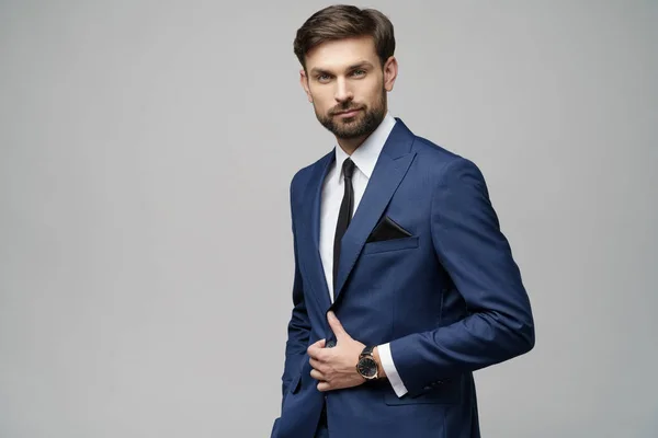 Studio photo of young handsome businessman wearing suit — Stock Photo, Image