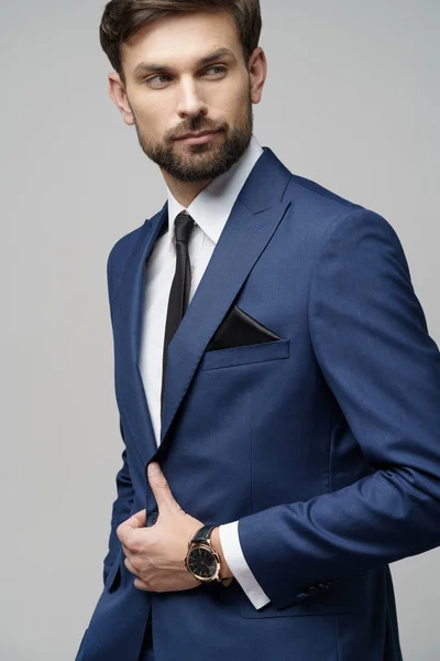 Studio photo of young handsome businessman wearing suit — Stock Photo, Image