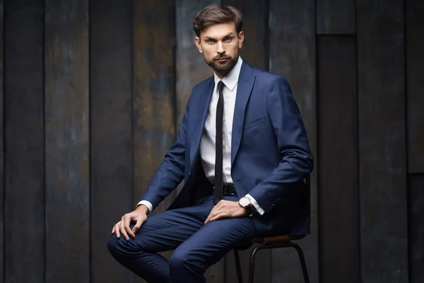 Indoor photo of young handsome stylish businessman wearing suit — Stock Photo, Image