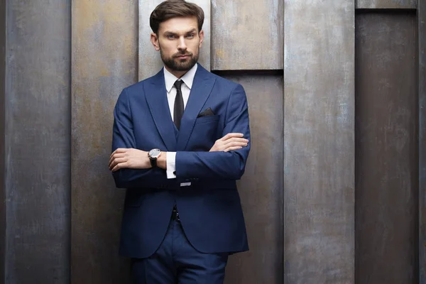 Indoor photo of young handsome stylish businessman wearing suit — Stock Photo, Image