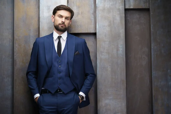 Indoor photo of young handsome stylish businessman wearing suit — Stock Photo, Image