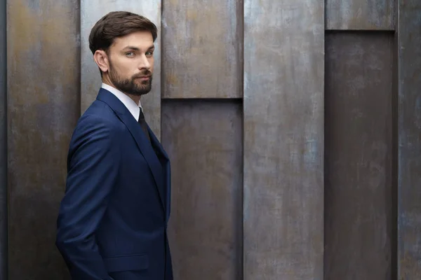 stock image indoor photo of young handsome stylish businessman wearing suit