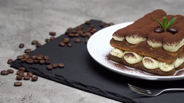 Classic tiramisu dessert on ceramic plate on concrete background — Stock Video