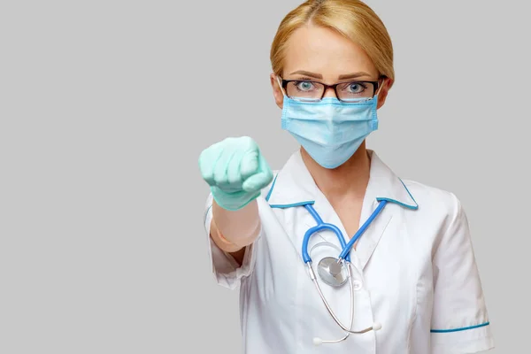 Medical doctor nurse woman with stethoscope wearing protective mask — Stock Photo, Image